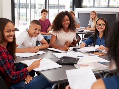 Group of girls and boys in classroom