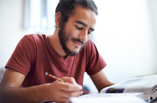 Man with beard holding a pencil