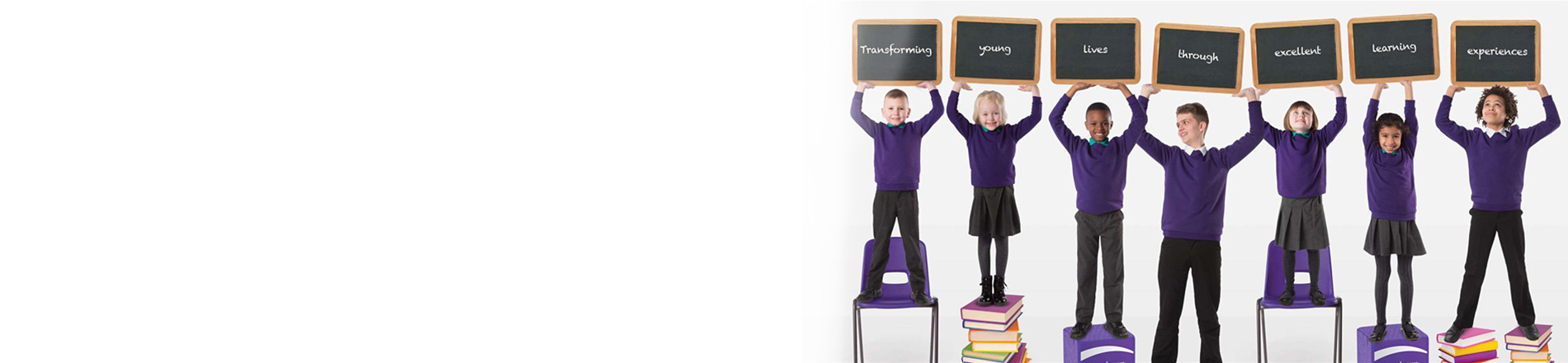 Children holding up small blackboards