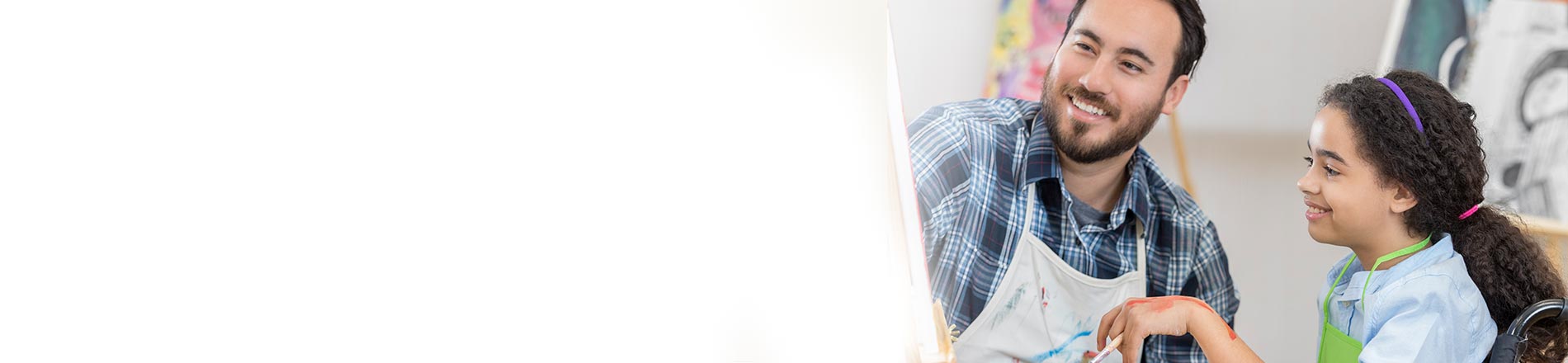 Man and young girl in wheelchair Man and young girl in wheelchair