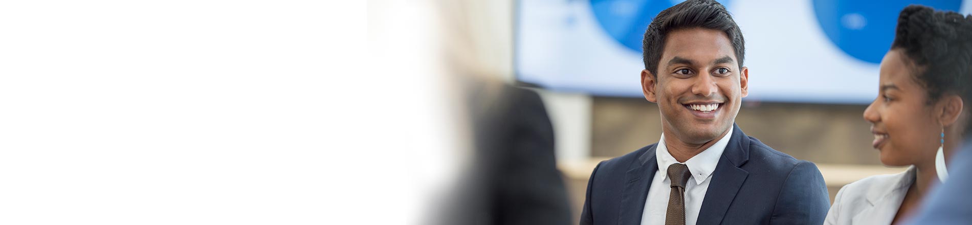 Man in suit smiling at woman Man in suit smiling at woman