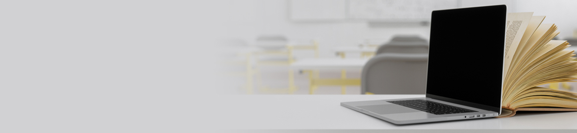 Laptop and an open book Laptop and an open book